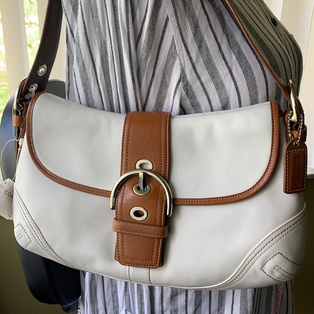 Coach bag with brown leather trims.